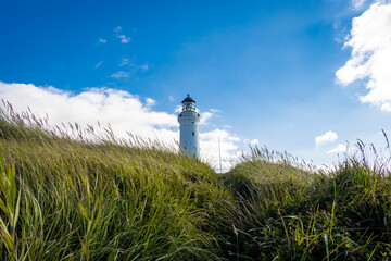 Fototapeta premium An old white lighthouse in Frederikshavn, hritshals, Denmark build during World War