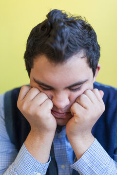 Middle Eastern man with Down Syndrome thinking
