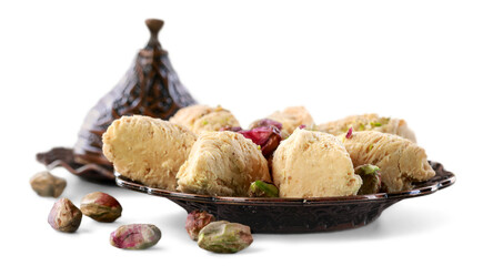 Bronze plate with arabian sweets. Ramadan Kareem.
