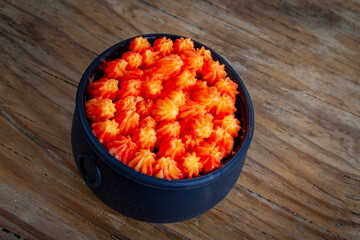Homemade Cauldron Cake on light brown background above shot