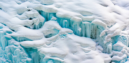 Close up of a snow-covered ice waterfalls, Banff National Park; Banff, Alberta, Canada