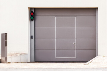 Garage Gate or Entrance Door to Underground Private Car Parking of Apartment Building. Modern Garage Gate with Entrance Door,  Security System for Car Park