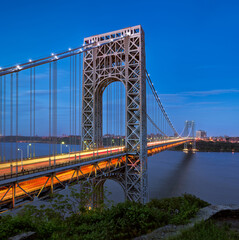 The George Washington Bridge (long-span suspension bridge) across the Hudson River in evening connecting New Jersey with Upper Manhattan, New York City