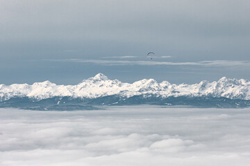 Paraglider, Parachute Pilot, Sailing, Flying Over Julian Alps, Mountain View, Descending Into The Foggy Valley Below, Cloudy Day, Monotone 