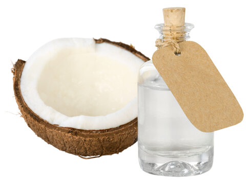 Liquid coconut oil and halved coco-nut