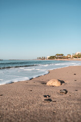 empty beach in the mediterranean sea on a sunny day