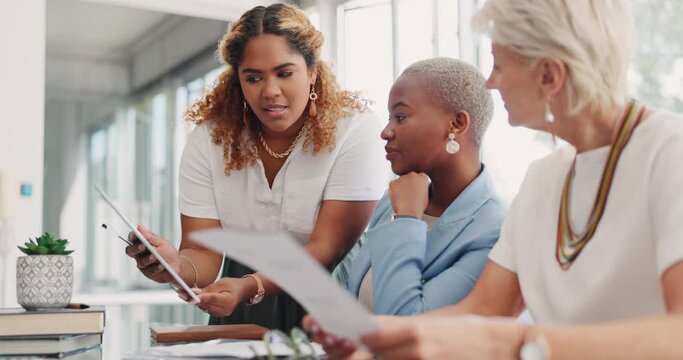 Teamwork, technology and business women in discussion with paperwork for a project in office. Collaboration, professional and corporate team consulting on report, proposal or document in workplace.