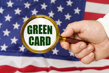 In front of the American flag, a man holds a magnifying glass in his hand with the inscription -...