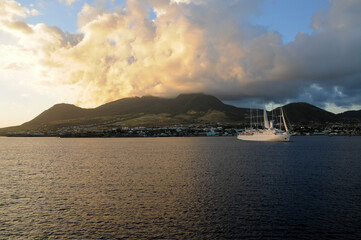sunset close to St. Kitts caribbean island and cruise ship