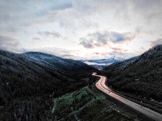 Aerial of Highway i70 near Silverthorne, Colorado at dusk with low clouds
