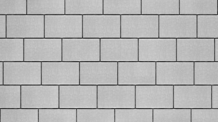 Grey brick wall background close up. Gray stone tile block background with horizontal texture of gray brick. Gray brick surface