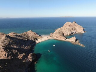 High aerial above sail boats in bay in Agua Verde, Baja Mexico