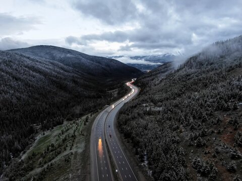 Highway I70 in Silverthorne Colorado in spring with low clouds at dusk