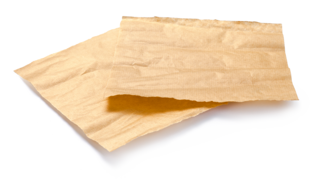 Baking paper isolated. Crumpled pieces of brown parchment or baking paper on white background. Design element.