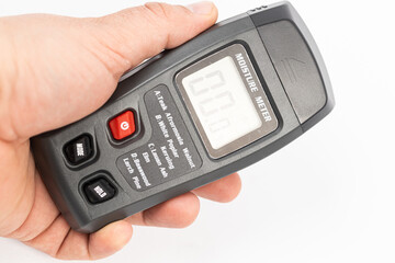 Moisture meter isolated above white background