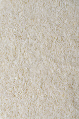 Top view of dry uncooked instant long grain rice as a background. Flat lay.