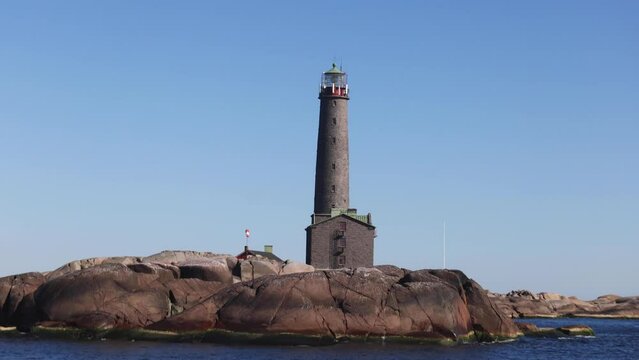 Bengtsk&auml;r Lighthouse, summer view of Bengtskar island in Archipelago Sea, Southwest Finland, Kimito&ouml;n, Gulf of Finland sunny day

