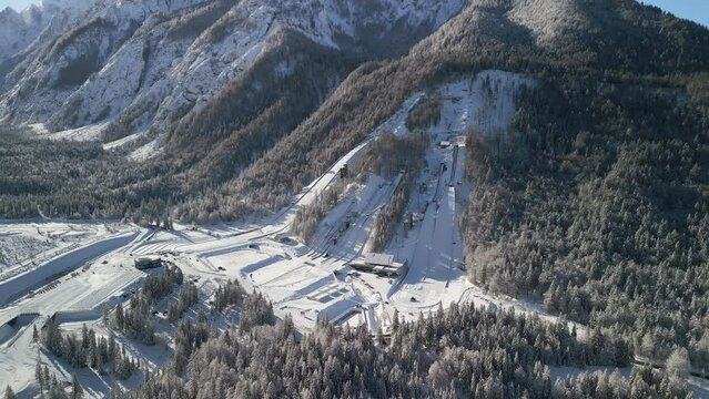 Ski Jump in Planica near Kranjska Gora Slovenia covered in snow at winter time, aerial view.