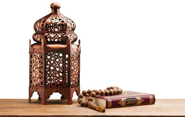 Islamic Holy Book Quran with rosary beads and ornamental arabic lantern