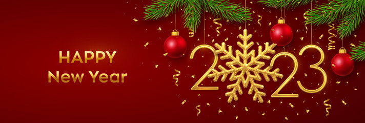Happy New 2023 Year. Hanging Golden metallic numbers 2023 with snowflake, balls, pine branches and confetti on red background. New Year greeting card or banner template. Holiday decoration. Vector.