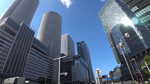 NAOGYA, JAPAN - OCTOBER 2022 : View of NAGOYA STATION and office buildings in daytime. Time lapse shot. Travel, tourism, business and transportation concept video.