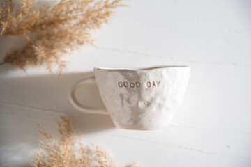 luxury hand made ceramic coffee cup with morning light