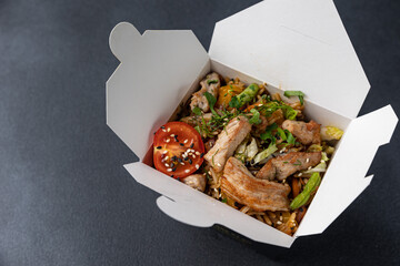Delicious wok noodles box container. Chinese and asian takeaway fast food.