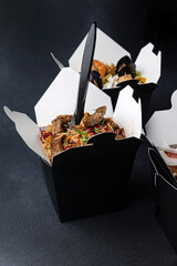 Delicious wok noodles box container. Chinese and asian takeaway fast food.