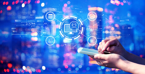 Document management system concept with person using a smartphone in a city at night