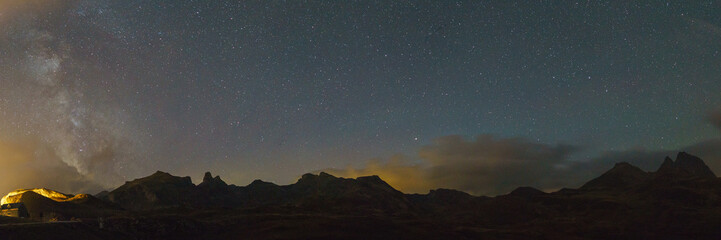 Panorama of landscape in the Pyrenees at night with Milky Way and Big Dipper constellation, Col du...
