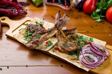rack of lamb kebab on wooden table on wooden table - 555260037