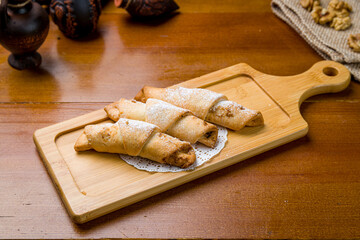 sekerpare on white plate on wooden table. Turkish cuisine