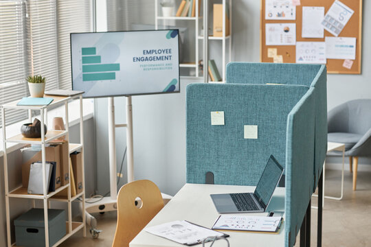 Background image of office workplace cubicle with laptop on desk, copy space