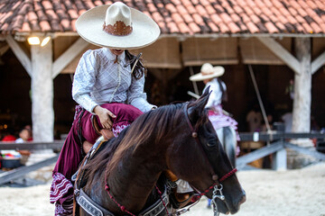 Beautiful Mexican equestrian show with a traditional hat on an Aztec horse of great lineage...