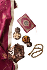 Composition with muslim lamp, holy book and arabic dessert