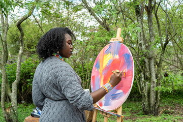 artist concentrating on her painting