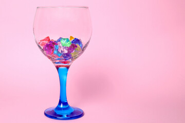 Wine glass and shiny crystal stones, copy space
