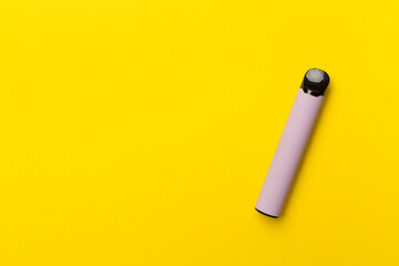 Disposable electronic cigarette on color background, top view