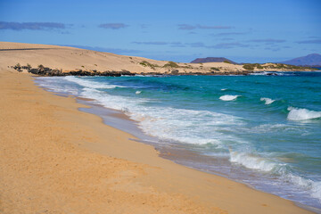 Moro beach in the Corralejo Natural Park in the north of Fuerteventura island in the Canaries, Spain - Waves in the Atlantic Ocean in winter