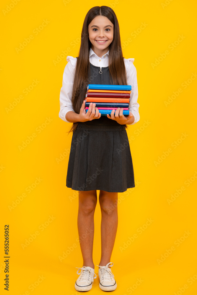 Canvas Prints schoolgirl with copy book posing on isolated background. literature lesson, grammar school. intellec