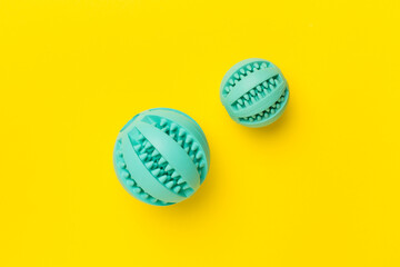 Blue ball toys for dogs on color background