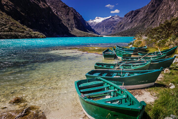 Llanganuco lake with boats in Cordillera Blanca, snowcapped Andes, Ancash, Peru