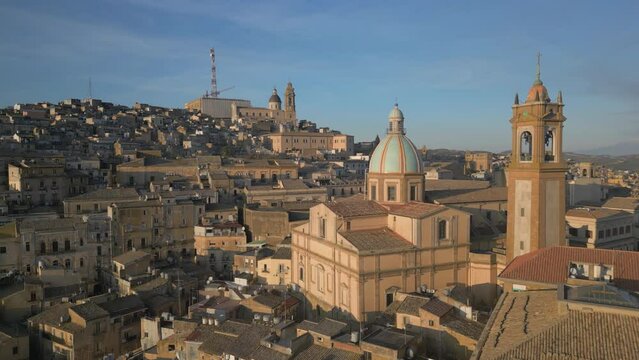 flying past Cathedral of San Giuliano towards center of Caltagirone Sicily