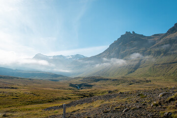 Obraz na płótnie Canvas View of surrounding mountains on a sunny day at Kirkjufell, Iceland