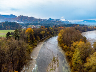 Colorful river with autumn colored trees
