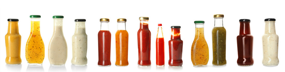 Collection of delicious sauces in bottles on white background