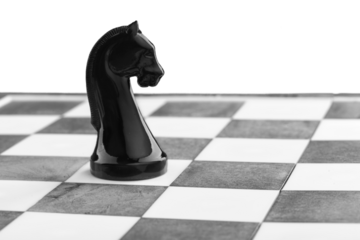 Wooden chess figures on a classic chessboard