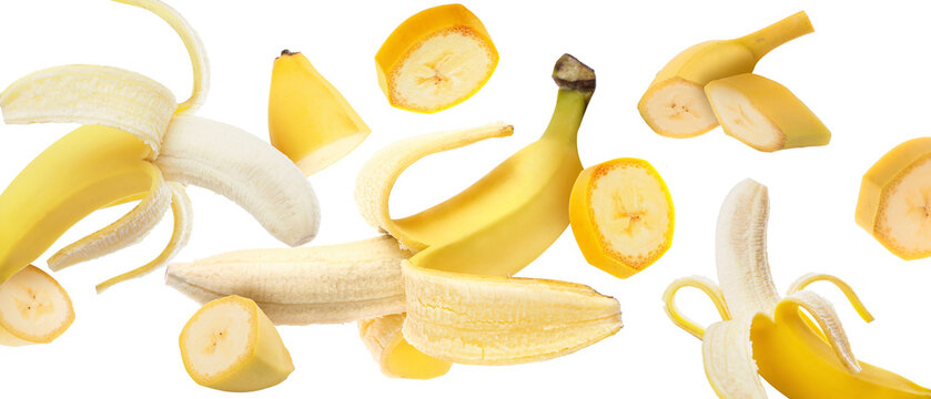 Flying fresh ripe bananas on white background