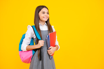School teenage girl with book and copybook. Teenager schoolgirl student, isolated background. Learning and knowledge. Go study. Education concept.