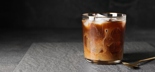 Glass of cold brew coffee on dark background